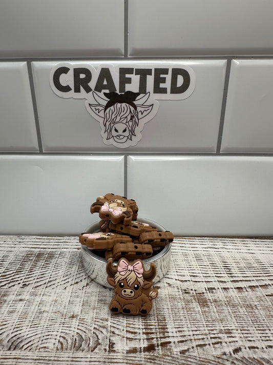 Girl highland cow with bow